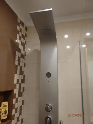 a shower in a bathroom with a tile wall at Tulipa View Apartament in Funchal