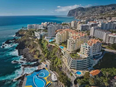 an aerial view of a resort next to the ocean at Oceanside Terrace Apartment by Holiday Rental Madeira in Funchal