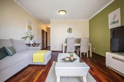 a living room with a couch and a table at Sea View Apartment in Santa Cruz