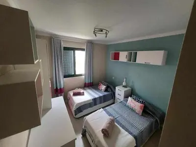 a small room with two beds and a couch at GuestReady - Nora Premium in Funchal
