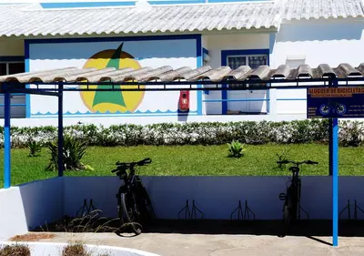 two bikes parked against a wall in front of a building at Parque de Campismo Orbitur Sagres in Sagres