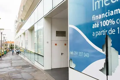 a building with a sign that reads international organizations are citizens a paint office at Dolce Vita - City Center & Shopping Center in Funchal
