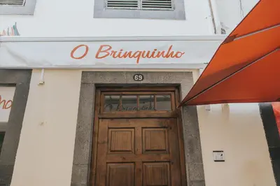 a entrance to a building with a wooden door at Old City Apartment in Funchal