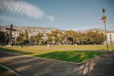 a park with a cross and a field of grass at Old City Apartment in Funchal