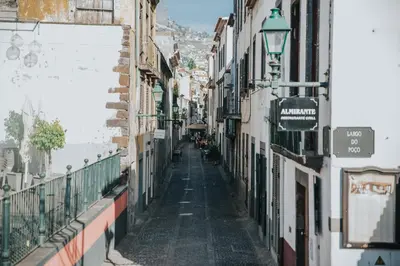 an alley in an old town with buildings at Old City Apartment in Funchal