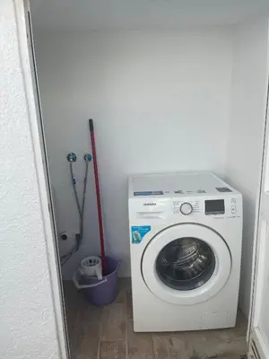 a washing machine in a small room with at Villa Waterside in Luz