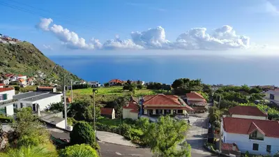 a house in the middle of a mountain at Vista Romantica Madeira in Arco da Calheta