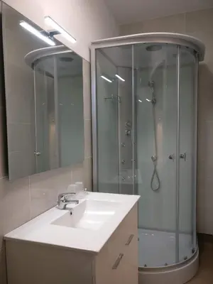 a bathroom with a sink and a shower at Museum House in Funchal
