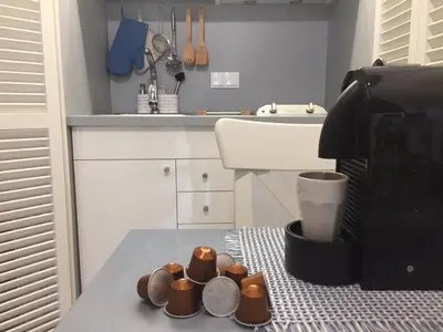 a bathroom with a sink and a mirror at Apartamentos do Mar in Funchal
