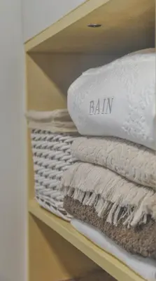 a bunch of towels are sitting on a shelf at Apartamentos do Mar in Funchal