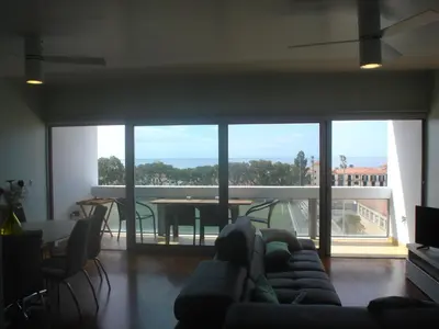 a living room with a couch and a table with a view at Shearwaternest 2 Apartment in Funchal