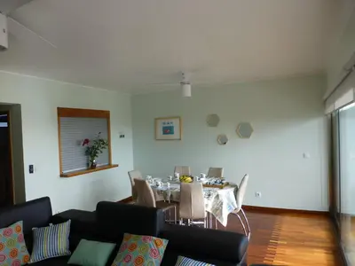 a living room with a table and a dining room at Shearwaternest 2 Apartment in Funchal