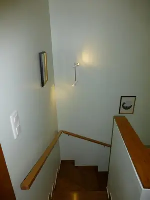a staircase in a building with a light on the wall at Shearwaternest 2 Apartment in Funchal