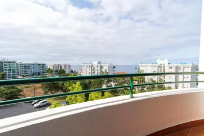 a balcony with a view of a city at Apartamento Rodrigues in Funchal