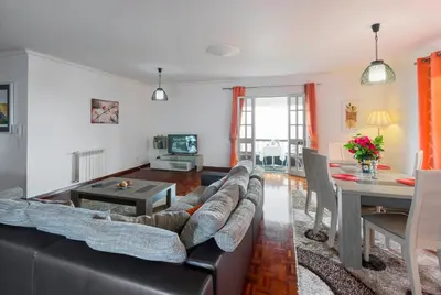 a living room with a couch and a table at Charming Apartments in Funchal - São Gonçalo in Funchal