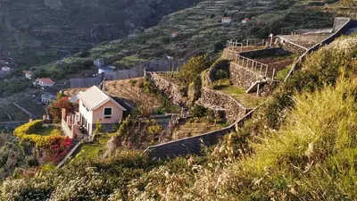 a village on the side of a hill at Quinta Terezinha in Ribeira Brava