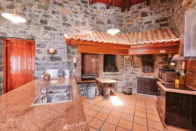 a living room with a couch and a table at Seixal Sunny Villa A & B by Amazing Madeira in Seixal