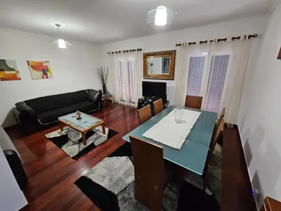 a living room with a table and a couch at Apartment Bonimar in Funchal