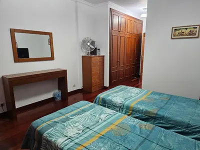 a hotel room with two beds and a fan at Apartment Bonimar in Funchal