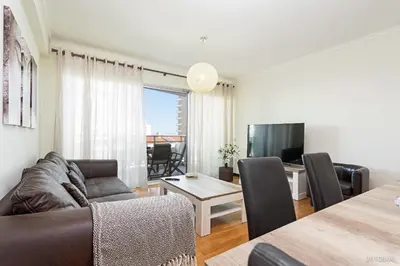 a living room with a couch and a table at Rodamar I by An Island Apart in Funchal