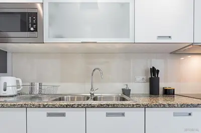 a kitchen with a sink and a microwave at Santa Catarina l by An Island Apart in Funchal