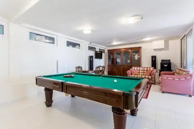 a living room with a pool table in it at Top Cliff Villa with Ocean View and Private Pool UP to 18 Guests in Burgau