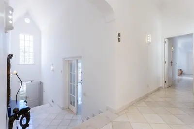 a white hallway with white walls and white floors at Top Cliff Villa with Ocean View and Private Pool UP to 18 Guests in Burgau