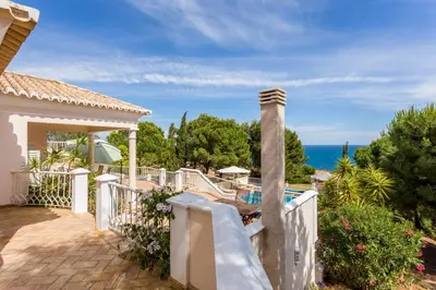 a house with a white fence and a swimming pool at Top Cliff Villa with Ocean View and Private Pool UP to 18 Guests in Burgau