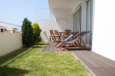 a pair of chairs sitting on a balcony at Mericia's Gorgeous View in Funchal