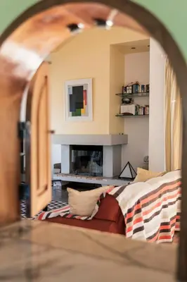 a living room with a couch and a fireplace at Great view to sea, villa with pool in Salema