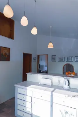 a kitchen with blue walls and a white counter top at Great view to sea, villa with pool in Salema