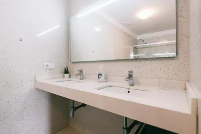a bathroom with a sink and a mirror at Casa Branca in Funchal
