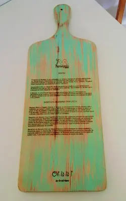 a wooden sign on a wall with writing on it at The Marketplace by Storytellers in Funchal