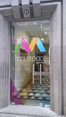 a window of a store with a sign in it at The Marketplace by Storytellers in Funchal