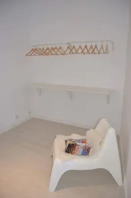 a white couch in a room with a shelf at Charming Apartment 101 in Funchal