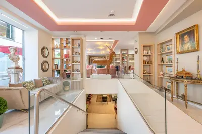 a room with a staircase and a living room at Sé Boutique Hotel in Funchal