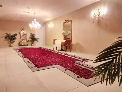 a living room with a large pool of red flowers at Sé Boutique Hotel in Funchal