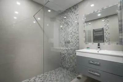 a kitchen with a staircase and a white door at ATLANTIC VIEW Apartment in Luz