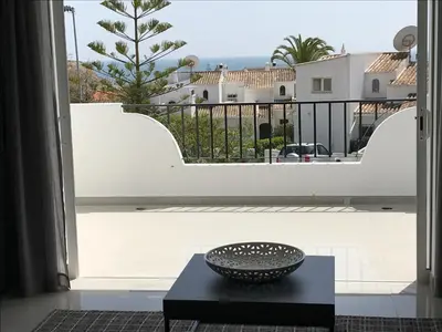 a bedroom with two beds with towels on them at ATLANTIC VIEW Apartment in Luz