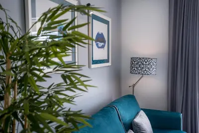 a bowl on a black table in front of a balcony at ATLANTIC VIEW Apartment in Luz