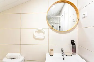 a bathroom with a sink and a mirror at Holiday Home Funchal Center in Funchal