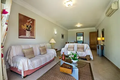 a living room with a couch and a bed at Luz casas- 44 Fairview village Boavista in Lagos