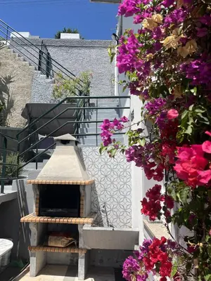 a gate to a house with a view of a mountain at Casa Vista do Ledo in Arco da Calheta