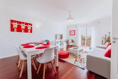 a white living room with a white table and chairs at Funchal Old Town Apartments 2.8 in Funchal
