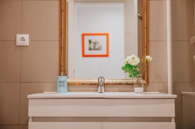 a bathroom with a sink and a mirror at Funchal Old Town Apartments 2.8 in Funchal