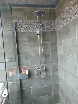 a shower with a shower head in a bathroom at Marques House in Machico