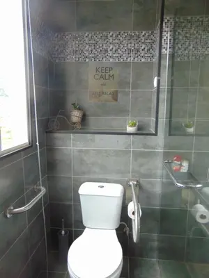 a bathroom with a toilet and a shower at Marques House in Machico