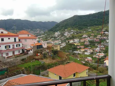 a view of a town on a hill with houses at Marques House in Machico