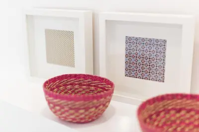 two red baskets sitting in front of two pictures at Casa Do Mercado by Heart of Funchal in Funchal