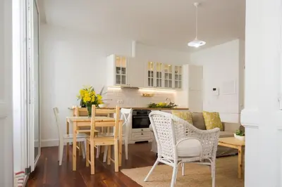 a kitchen and dining room with a table and chairs at Casa Do Mercado by Heart of Funchal in Funchal
